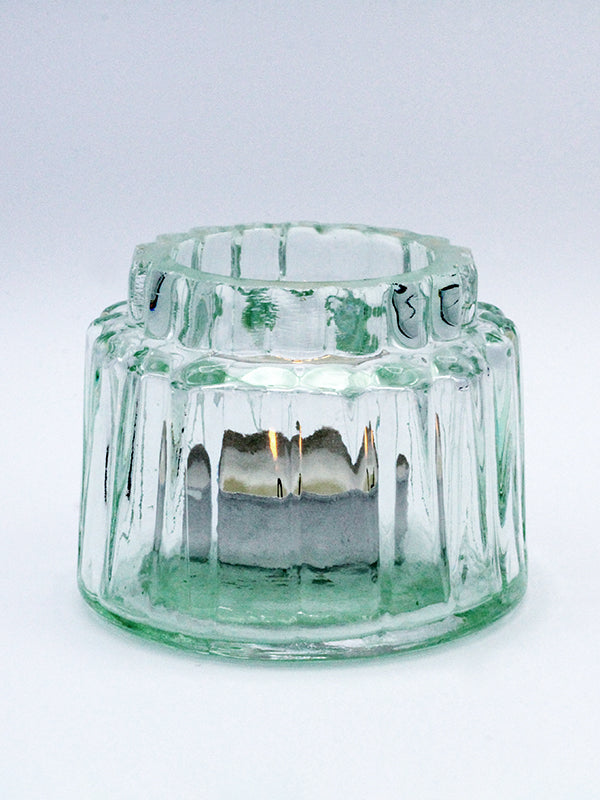 Ribbed Glass Tealight Holder Isolated With Candle